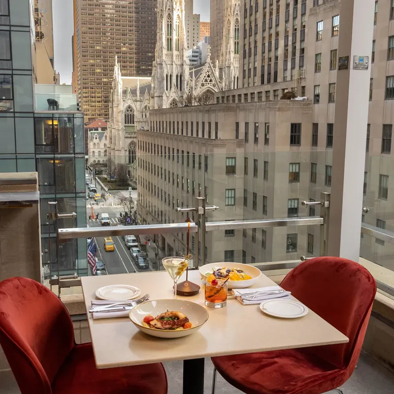Terrace tables with red velvet chairs